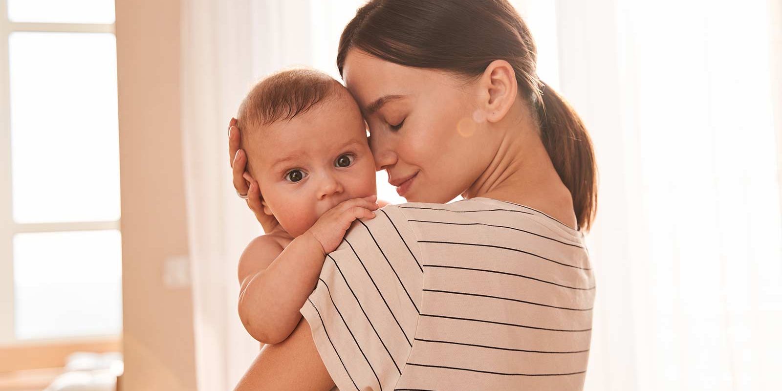 Loving Mother and Baby in Diapers